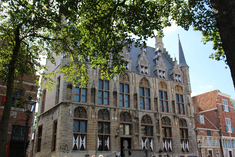 Ornate historic building with arched windows and spire.