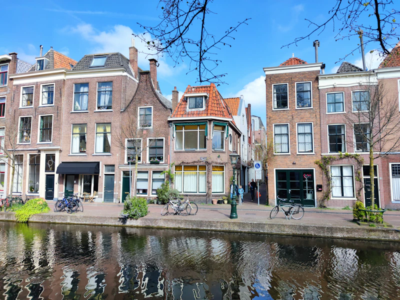 a group of buildings next to a body of water