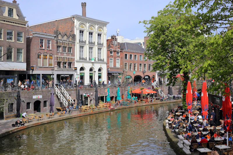 a river running through a city next to tall buildings